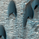 Illustration for article titled Uh, what the hell are these v-shaped formations doing on Mars?
